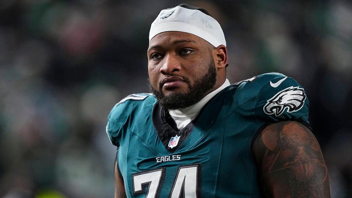 Fred Johnson of the Philadelphia Eagles exiting the field during a football game.