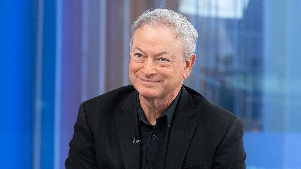 Gary Sinise standing in Fox News Channel Studios during Fox & Friends visit