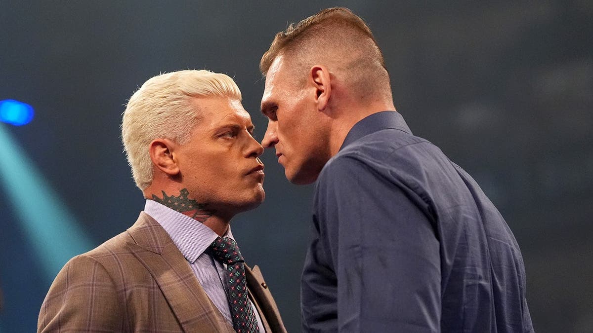 Gunther and Cody Rhodes face off in a wrestling ring at Olimpic Arena