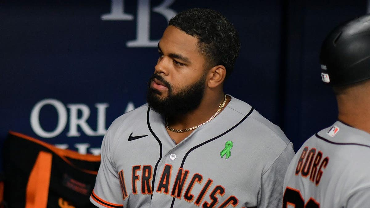 San Francisco Giants outfielder Heliot Ramos walking into dugout at Tropicana Field