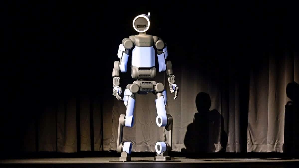 A Hyundai robot stands on a stage.