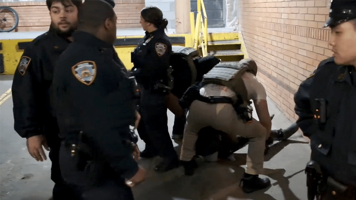 ICE agents dragging a migrant from a hospital