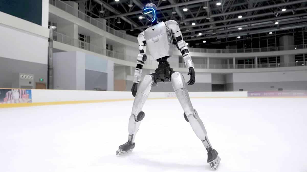 A humanoid robot skates on ice skates.