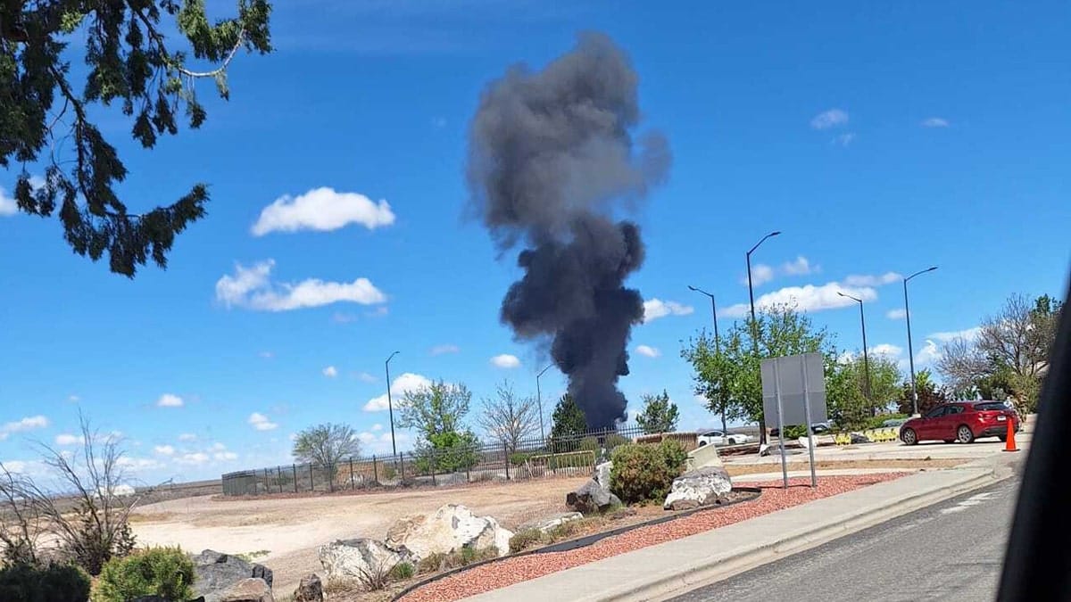 Black smoke rises from a crash site near Mountain Home Air Force Base in Idaho following an aircraft incident during the Gunfighter Skies Air Show.