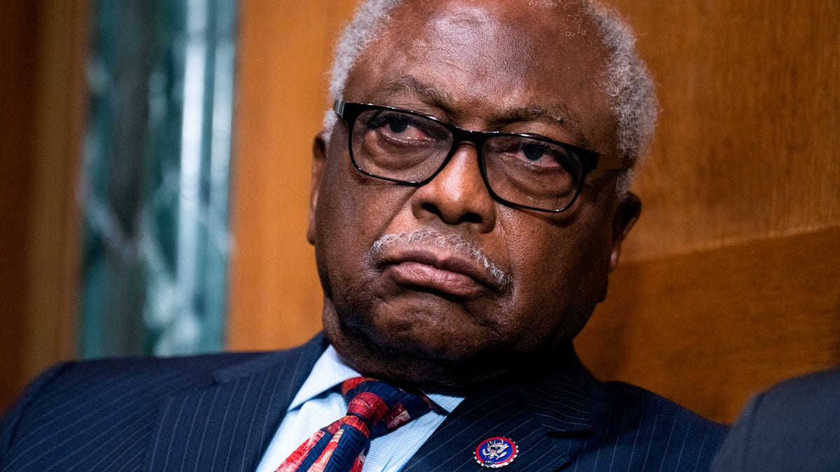 Former House Majority Whip Jim Clyburn listening to DeAndrea Gist Benjamin speaking