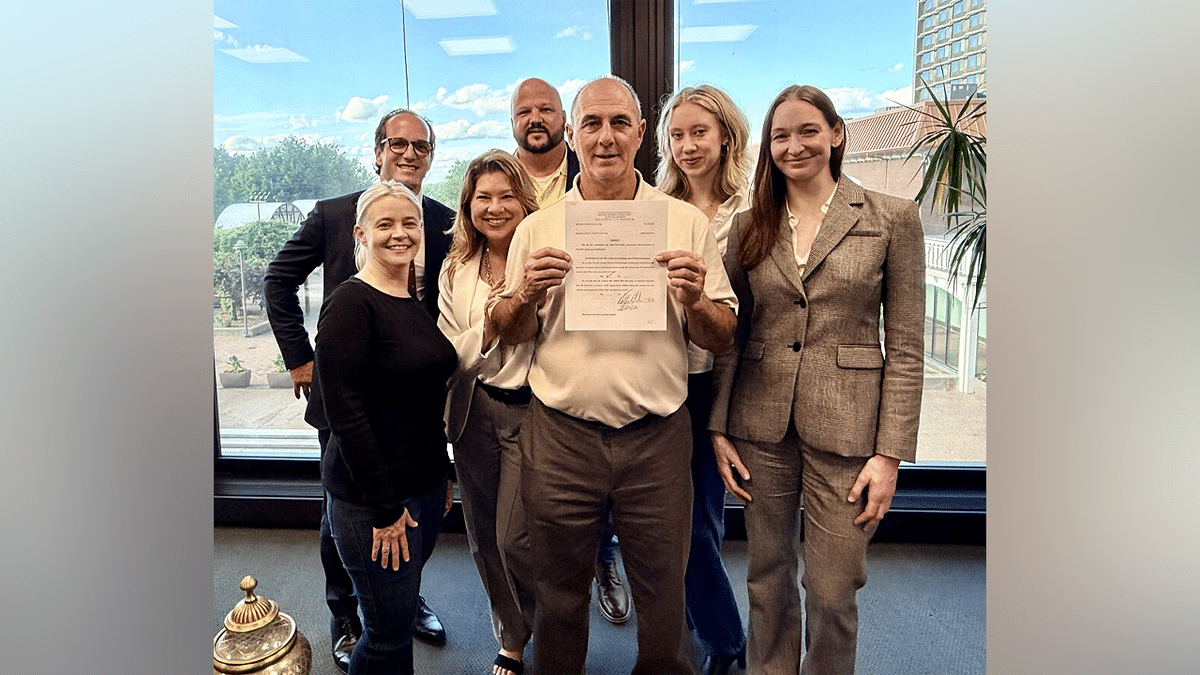 Jeffrey Clark with legal team after $24 million wrongful conviction verdict in Kentucky