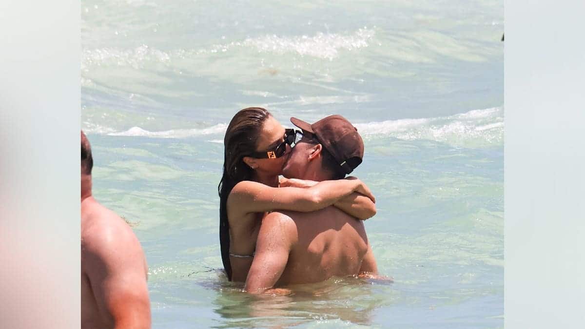 Jessica Alba and Danny Ramirez kissing while in the ocean in Miami in May 2026.