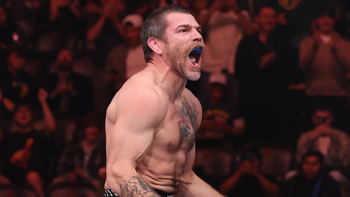 Jim Miller reacts after winning a lightweight fight at UFC 328 in Newark, New Jersey