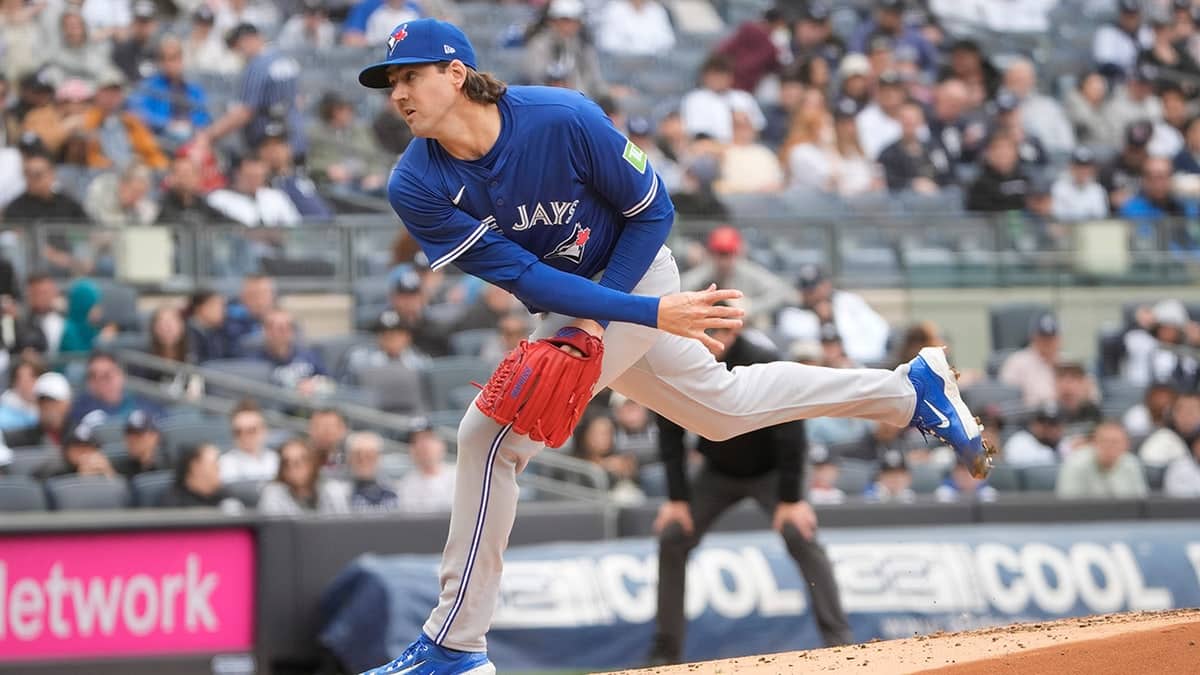 Toronto Blue Jays pitcher Kevin Gausman throwing a pitch on the mound.