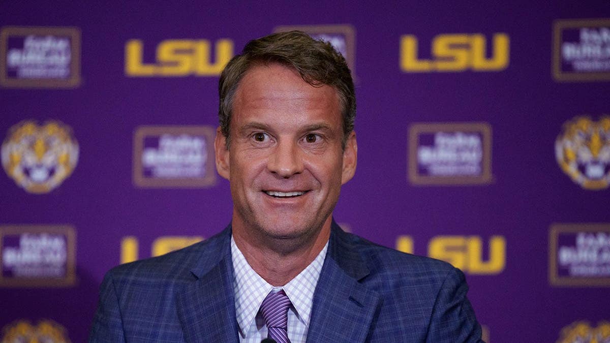 LSU head coach Lane Kiffin smiling