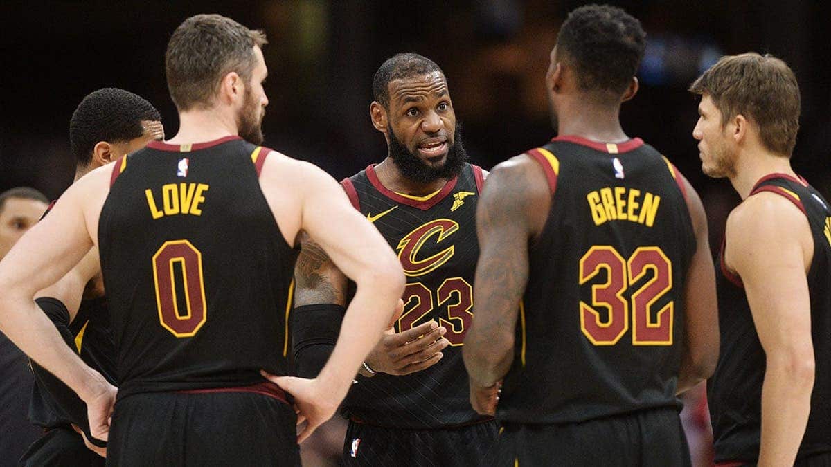 LeBron James talking to Cleveland Cavaliers teammates during a timeout at Quicken Loans Arena