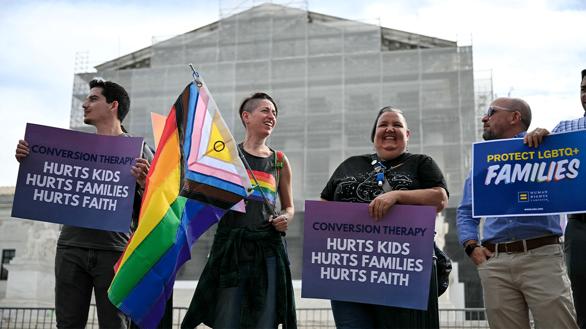 Demonstrators protesting against conversion therapy outside the U.S. Supreme Court in Washington, D.C.