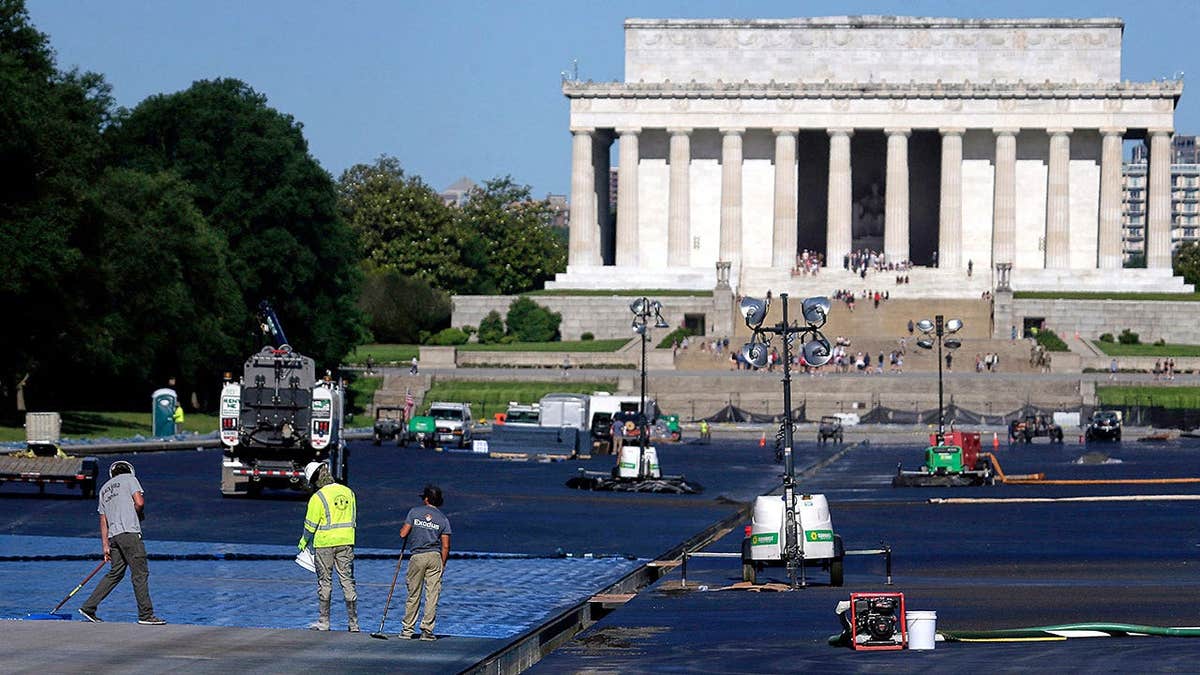 Blue protective coating being applied to Lincoln Memorial Reflecting Pool in Washington
