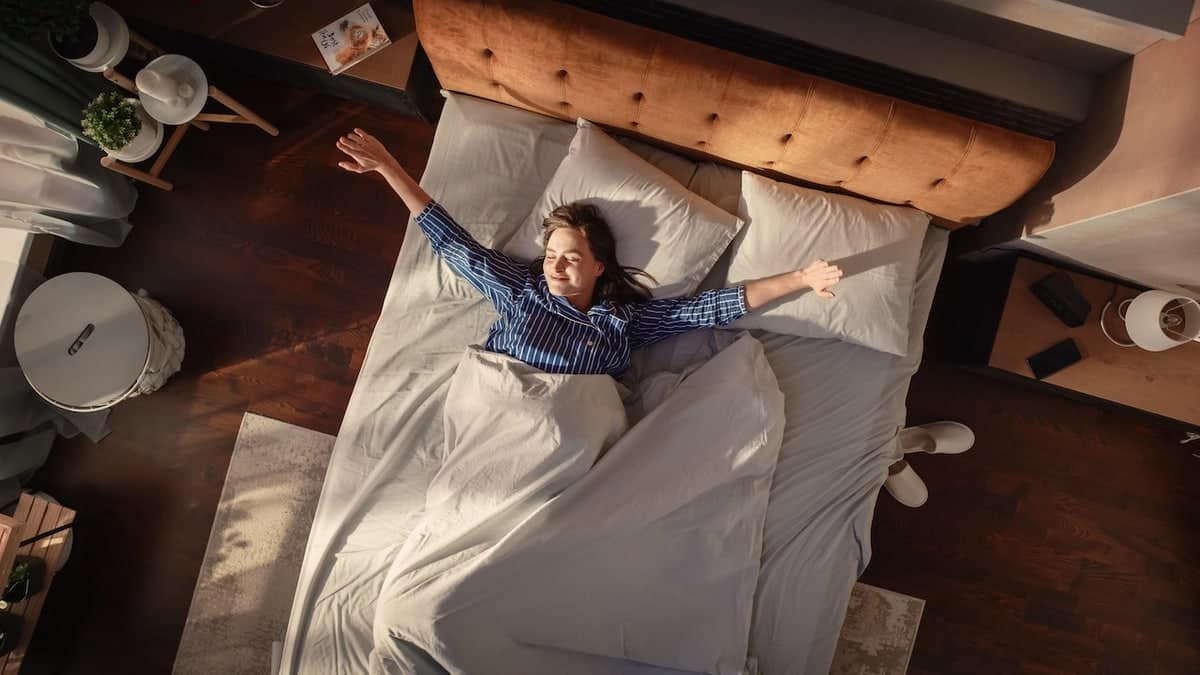 woman waking up in her bed