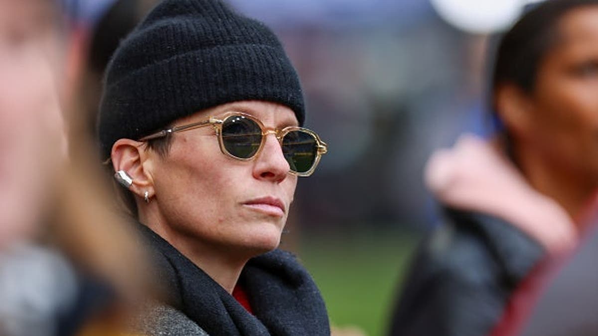 Former USWNT player Megan Rapinoe looking on before a match at Sports Illustrated Stadium