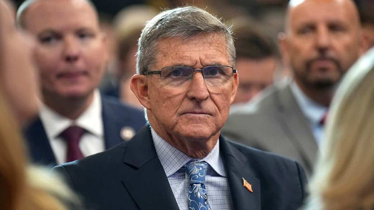 Michael Flynn looks on before Trump remarks at Justice Department.