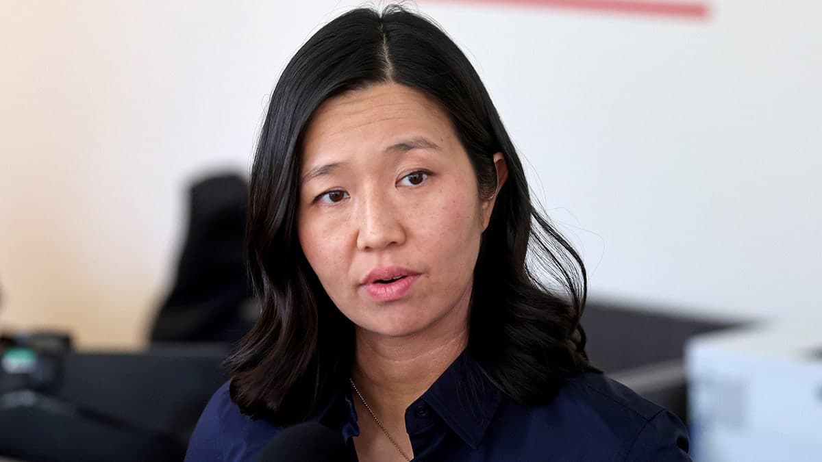 Boston Mayor Michelle Wu speaking at a podium