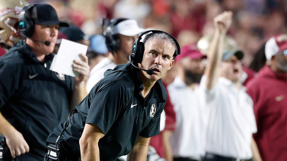 Florida State Seminoles head coach Mike Norvell reacting on sidelines during football game