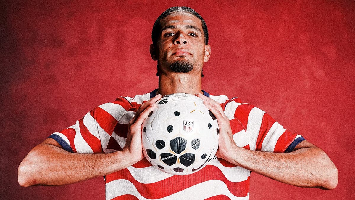 Miles Robinson posing for a portrait in Philadelphia, Pennsylvania.