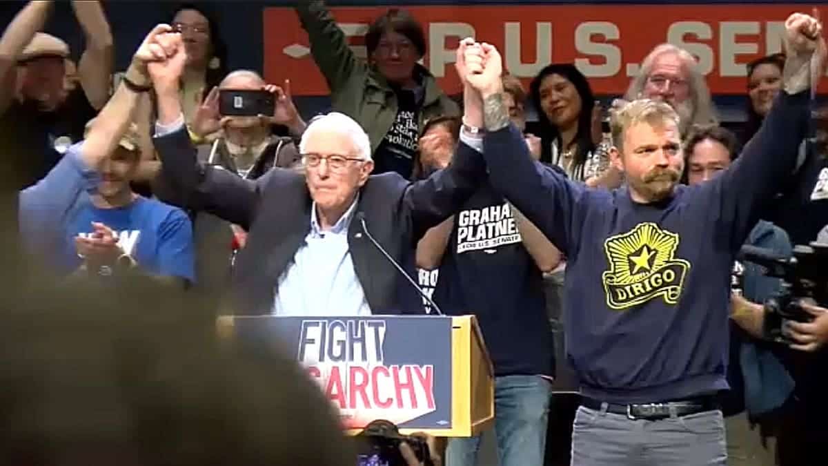 Bernie Sanders raising Graham Platner's hand