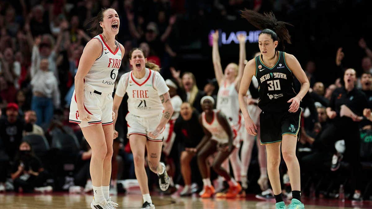 Portland Fire forward Bridget Carleton celebrating after scoring a three-point basket at Moda Center