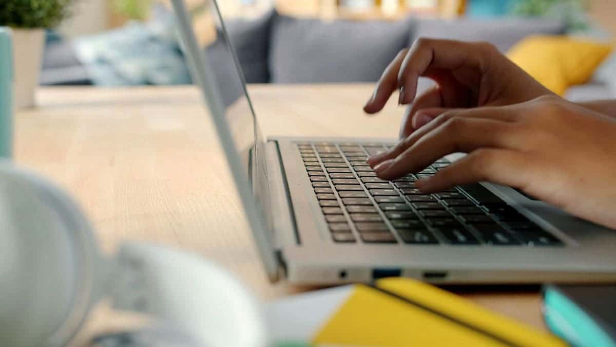 A person typing on a computer