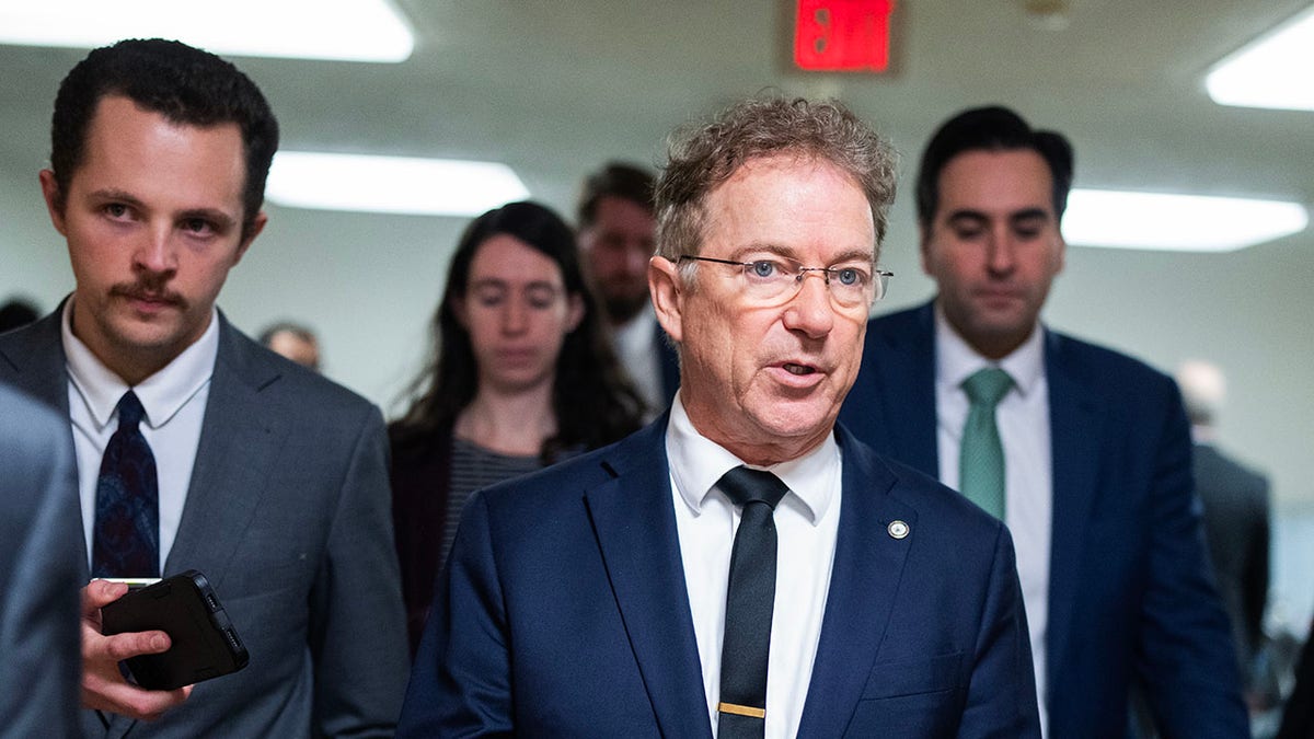 Sen. Rand Paul speaking with reporters in the Senate subway