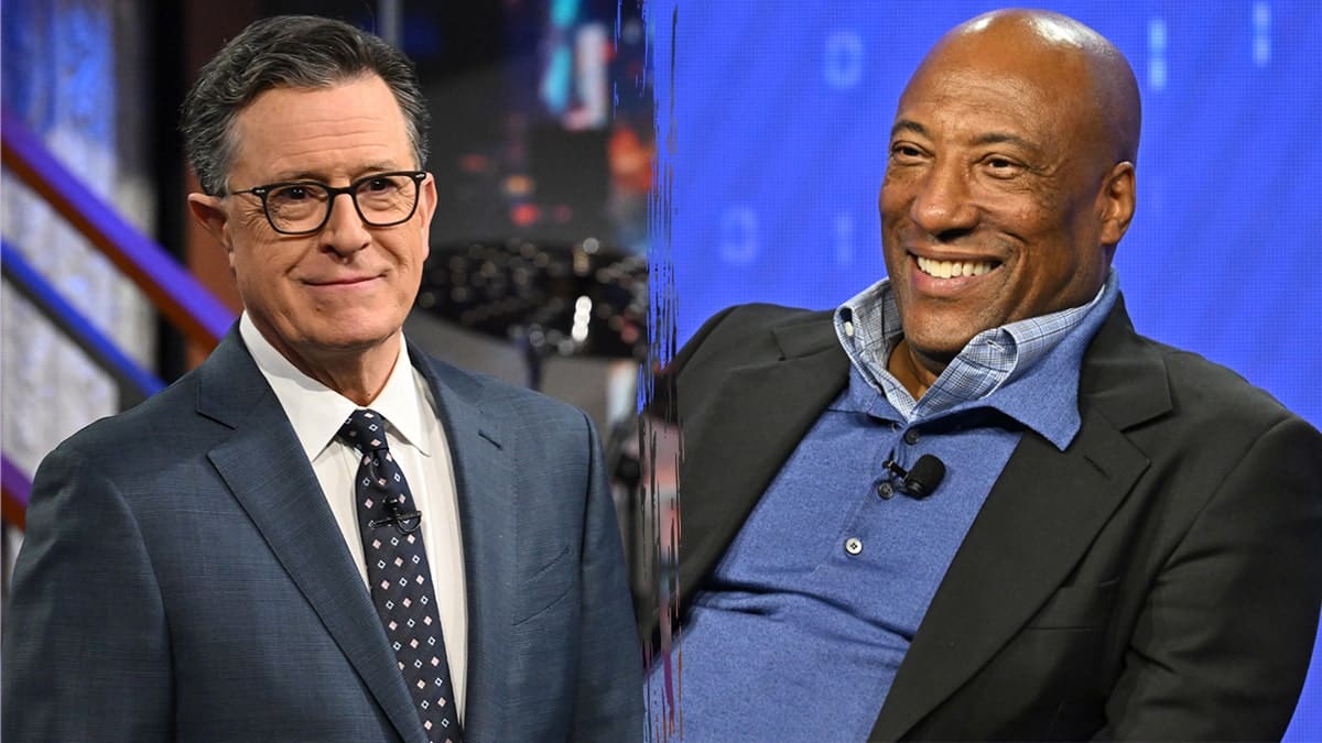 Stephen Colbert and Byron Allen standing together at an event