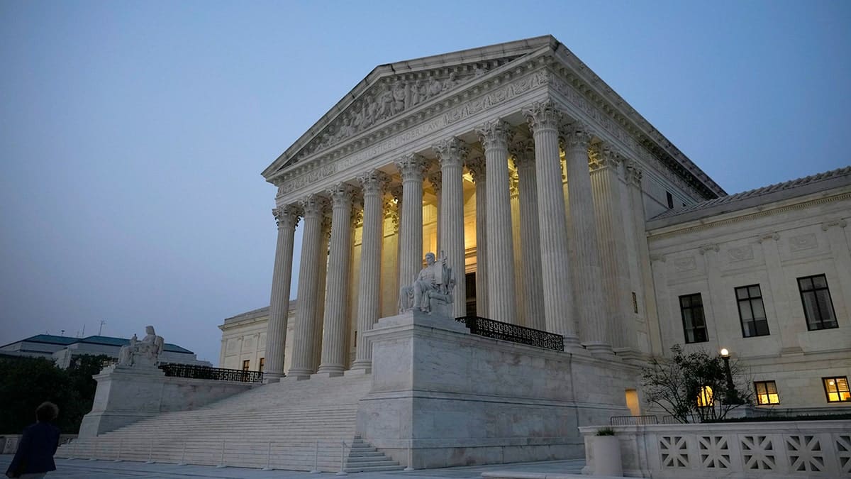 Supreme Court building at dusk.