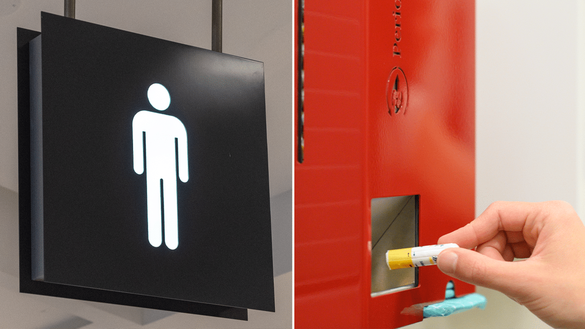 Men's restroom sign and tampon dispensary