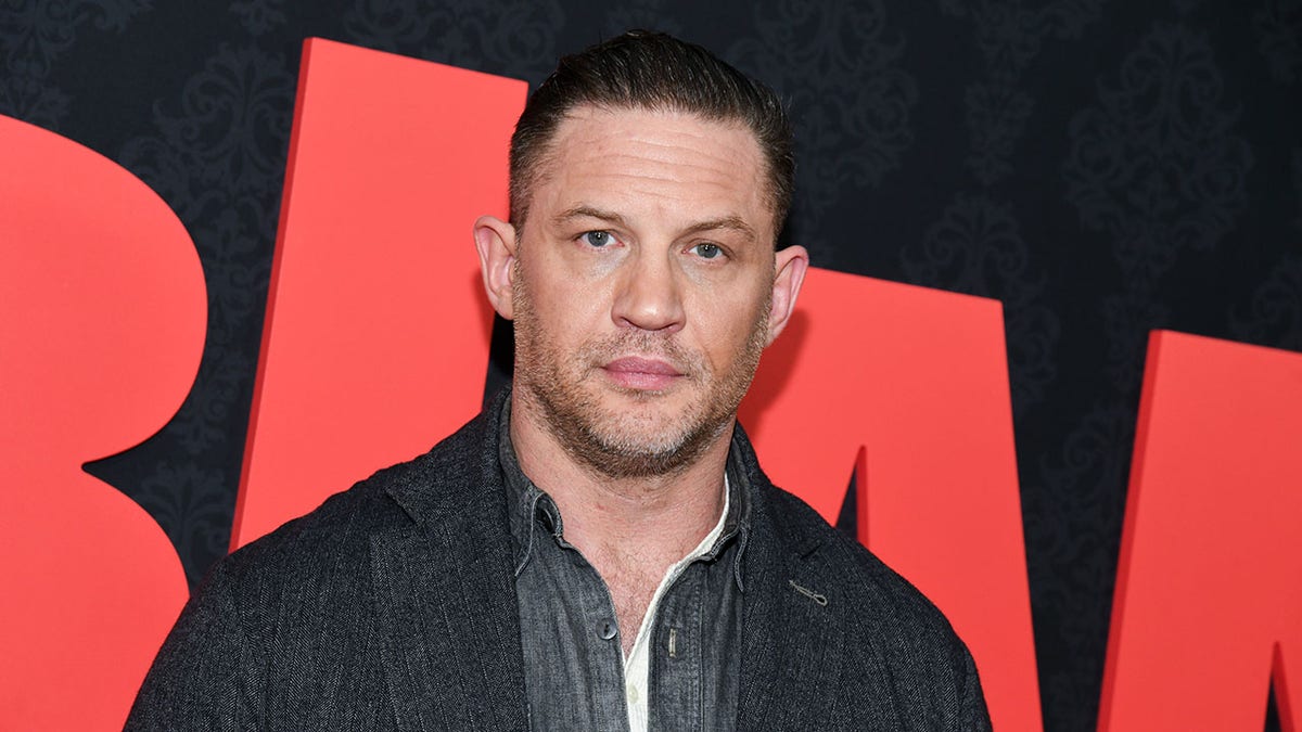 Tom Hardy standing at the MobLand New York premiere event