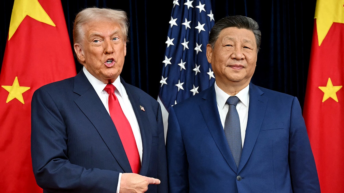 President Donald Trump standing next to President Xi Jinping