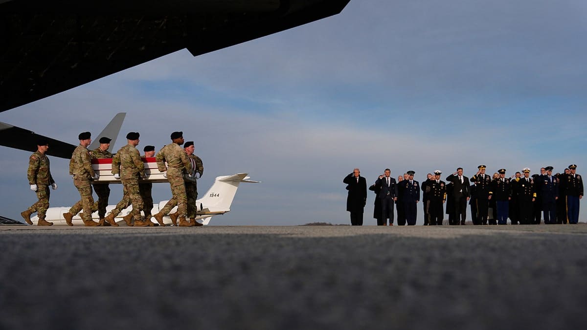 President Donald Trump and Defense Secretary Pete Hegseth watching transfer case at Dover Air Force Base