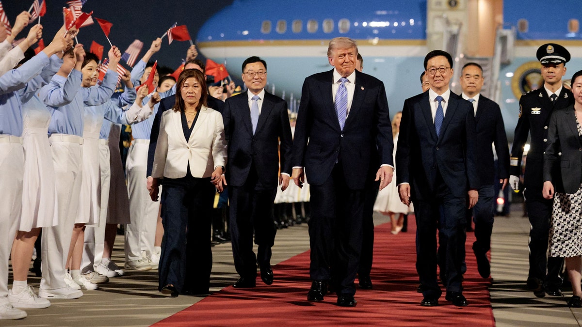 Trump with chinese vice president as he arrives in china