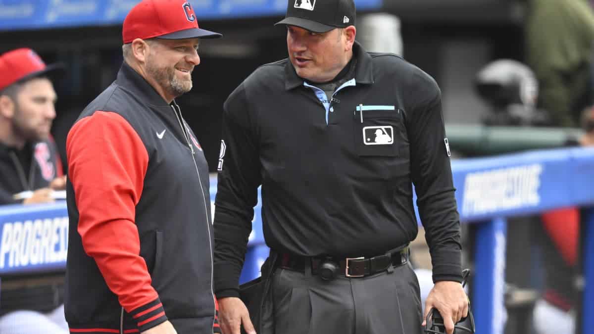Apr 5, 2026; Cleveland, Ohio, USA; Cleveland Guardians manager Stephen Vogt (12) talks with home plate umpire Dan Bellino (2) during a game against the Chicago Cubs at Progressive Field. Mandatory Credit: David Richard-Imagn Images