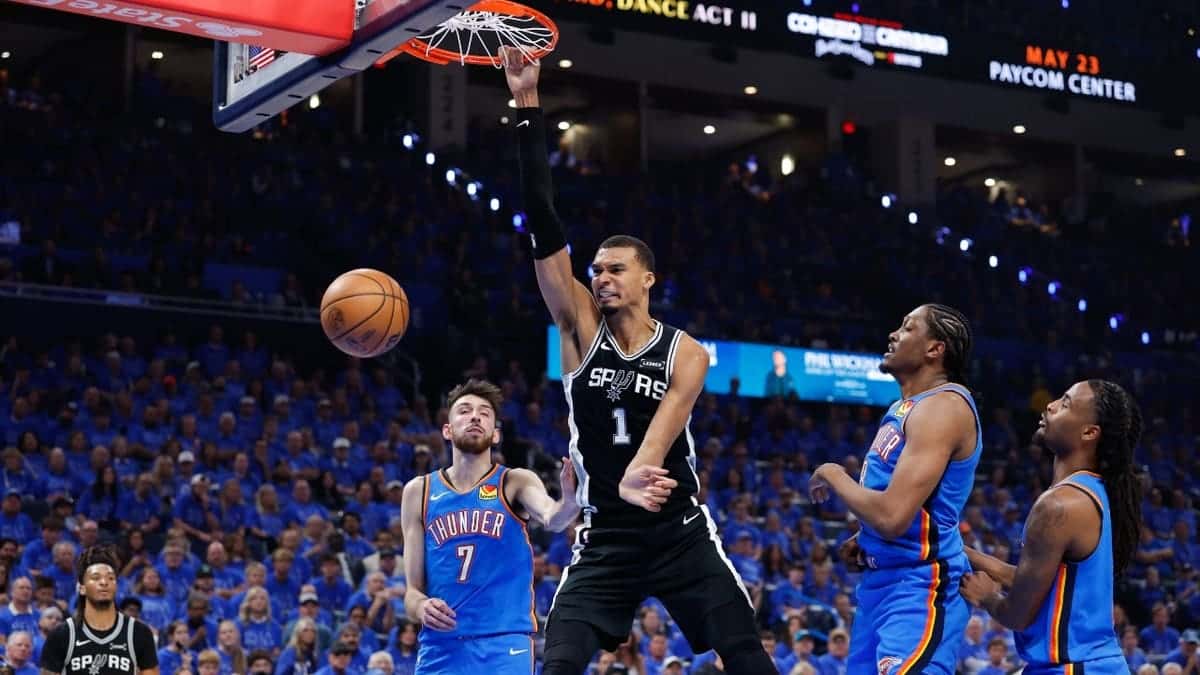Victor Wembanyama dunking basketball during NBA game in Oklahoma City