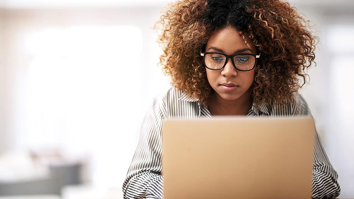 Woman Works on Laptop