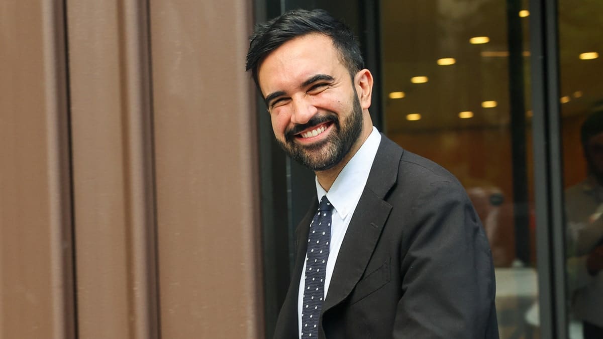 Zohran Mamdani smiling at a union endorsement event in New York City