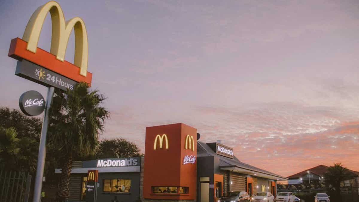A McDonald's sign on a building exterior.