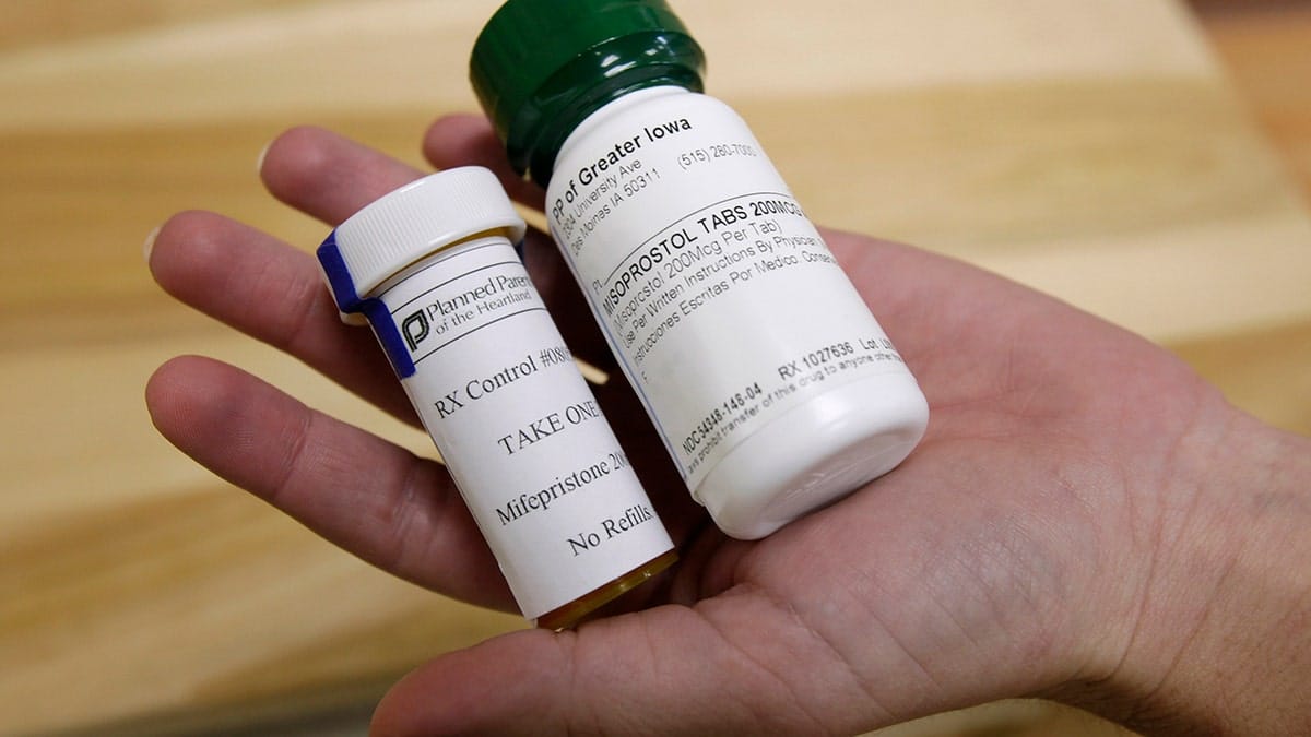 Bottles of abortion pills mifepristone and misoprostol on a clinic table.