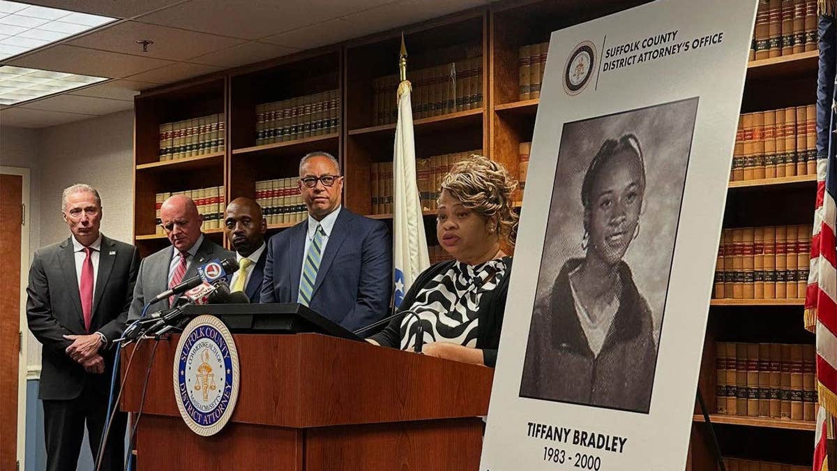 Press conference alongside a billboard of the late Tiffany Bradley