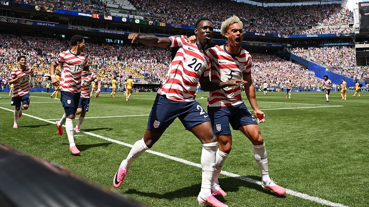 USMNT players Folarin Balogun and Antonee Robinson celebrating