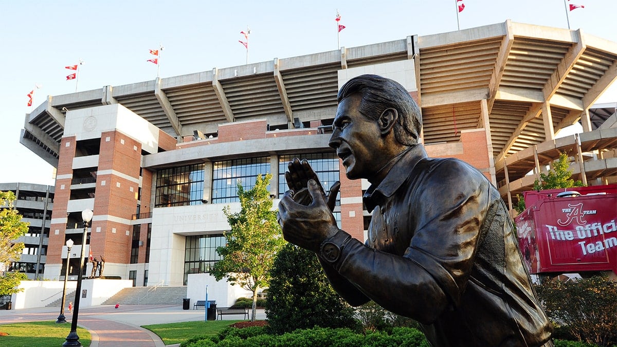 Nick Saban statue standing outside Bryant-Denny Stadium at University of Alabama campus