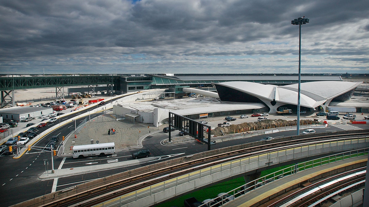 JetBlue Terminal 5 building at John F Kennedy International Airport with airplanes parked on tarmac