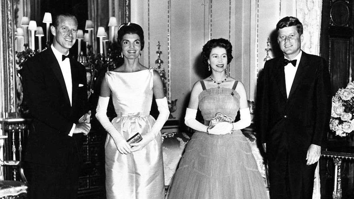 The Kennedys standing alongside Queen Elizabeth II and Prince Philip at Buckingham Palace.