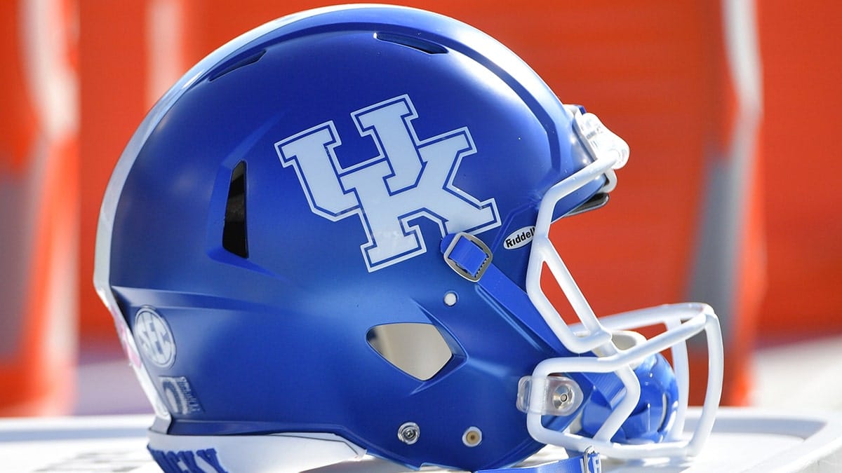 Kentucky Wildcats helmet on the field during a football game.