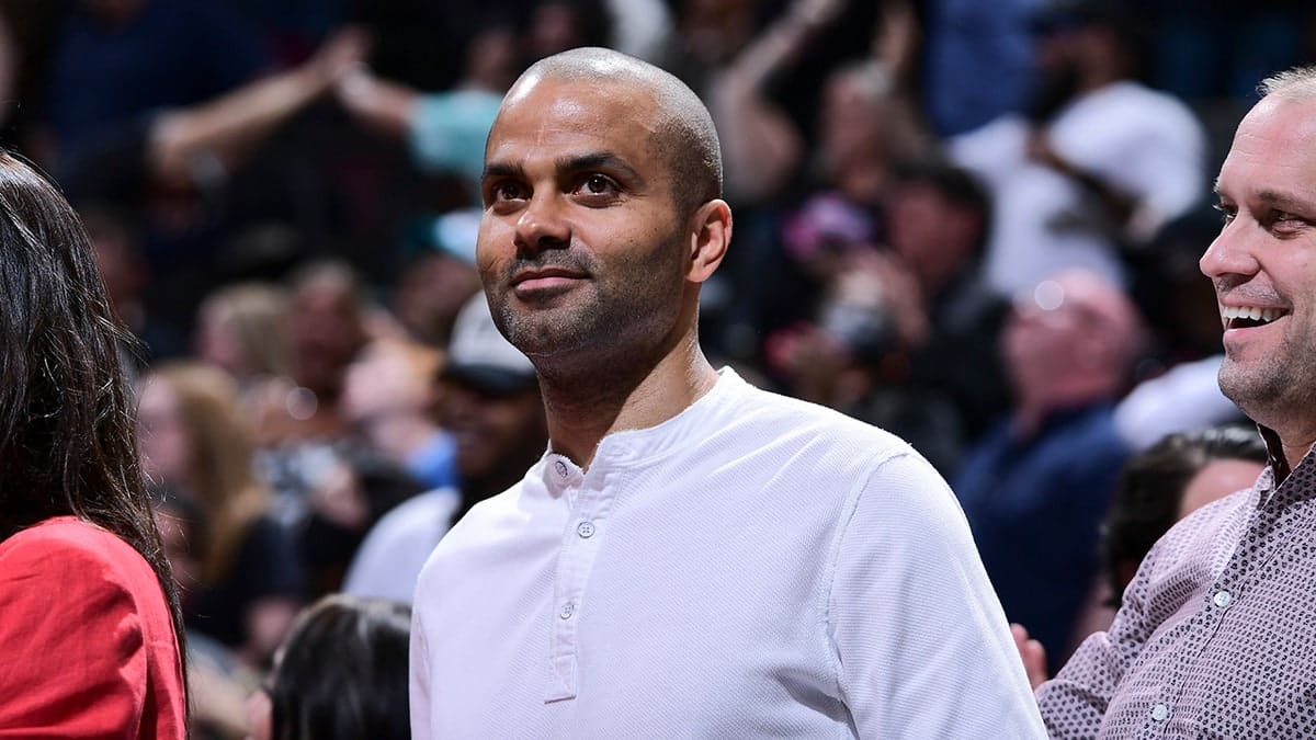 NBA legend Tony Parker standing courtside at a basketball game