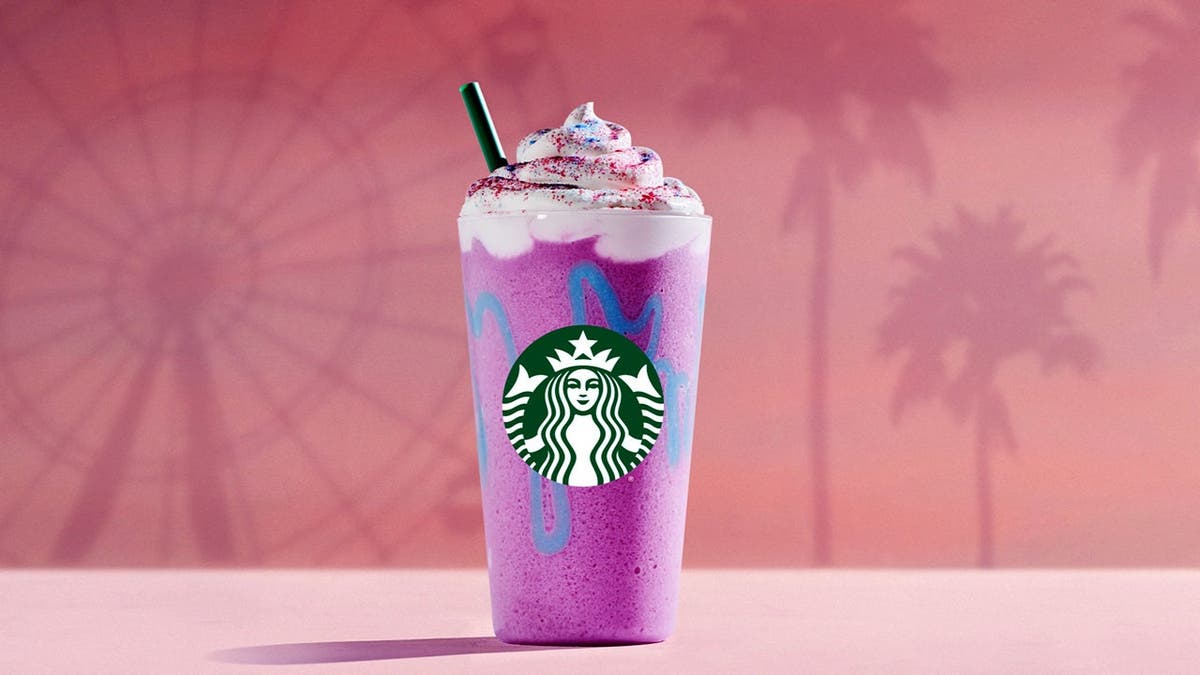 The Unicorn Frappuccino sits on a table.
