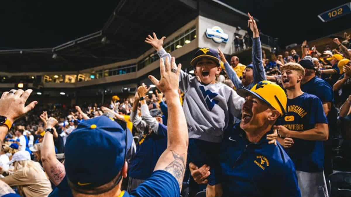 West Virginia fans celebrate the Mountaineers defeating Kentucky for a spot in the NCAA Tournament Super Regional