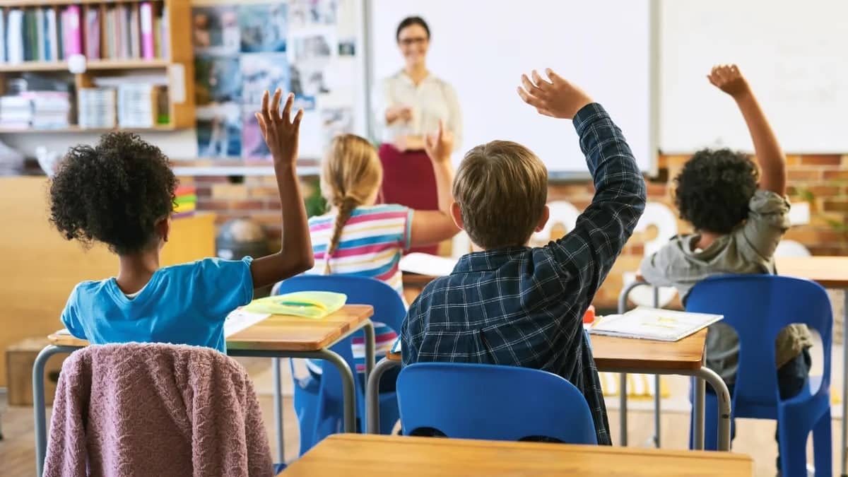 Students sitting in a classroom with artificial intelligence instruction